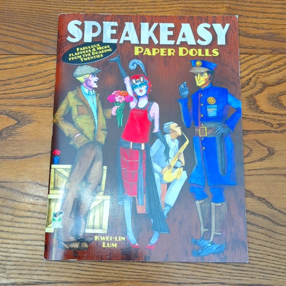 Dover published book of paper dolls.  Speakeasy. Fashion from the late 1920's.